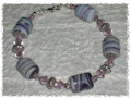 bracciale con perle in ceramica e cristalli